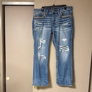 Buckle Men's Relaxed Fit Ripped Blue Jeans